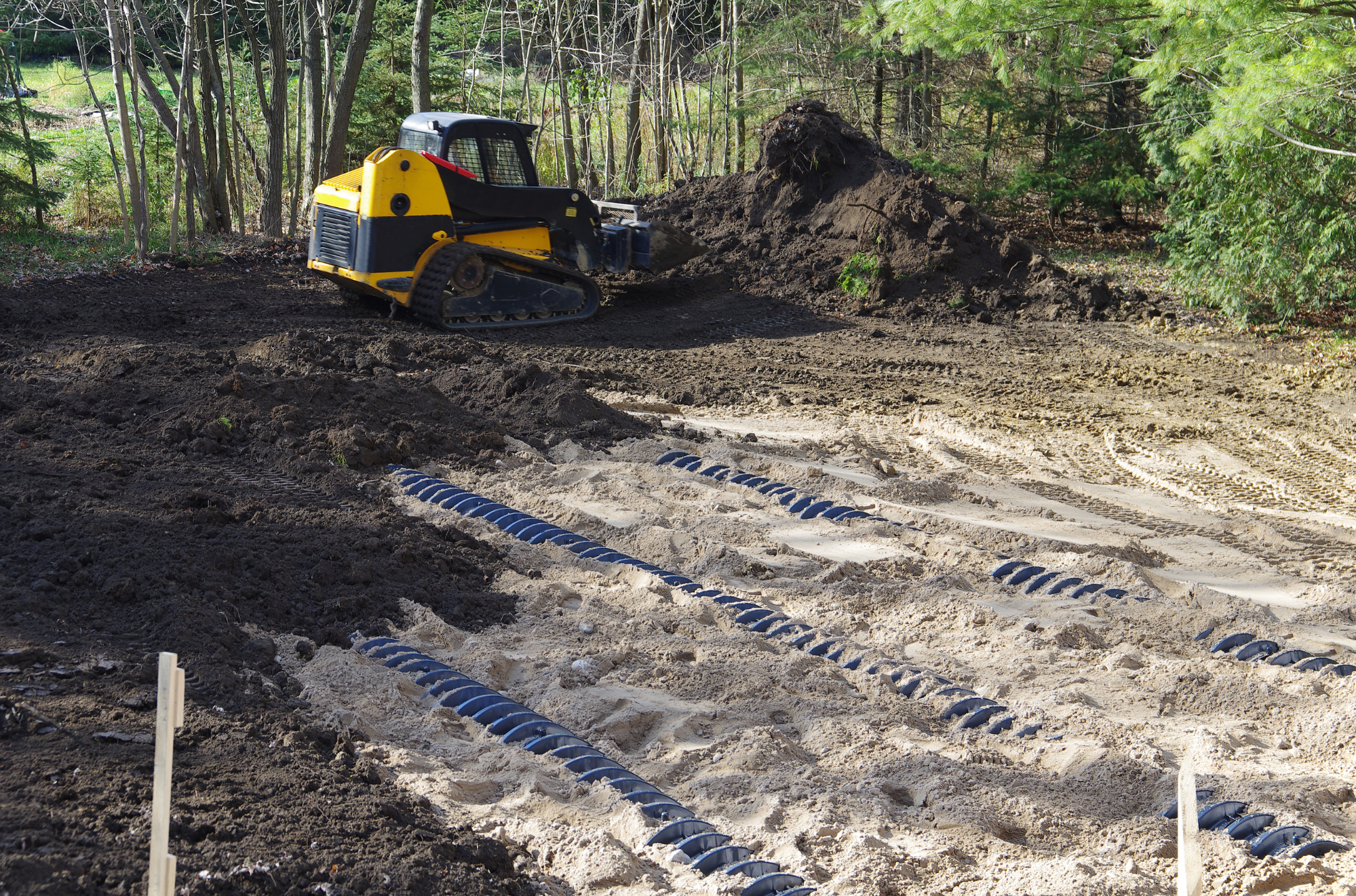 Septic leach or drainage field being installed